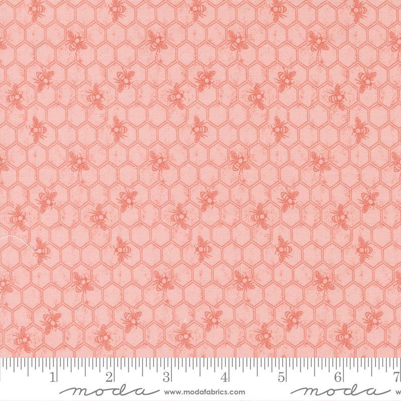 a repeating pattern of small hexagonal shapes in a light pink color, resembling a honeycomb design.