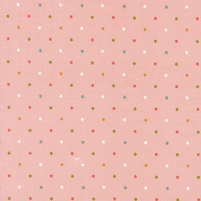 a pink background with a pattern of small white and multicolored dots arranged in a grid-like fashion.