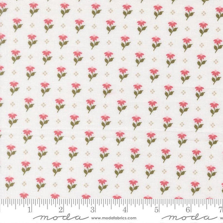 a repeating pattern of pink flowers on a white background, with a ruler for scale at the bottom.