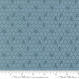 a repeating pattern of hexagons with small bee illustrations on a blue background.