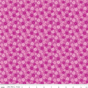a repeating pattern of pink and white flowers on a pink background.
