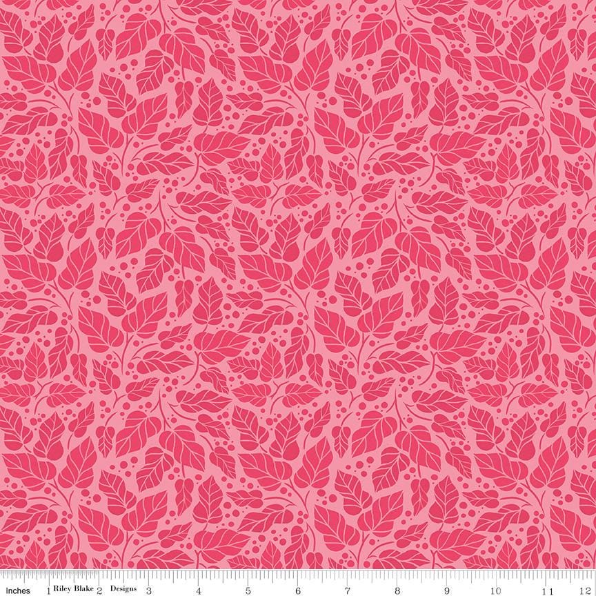 a repeating pattern of pink leaves and dots on a pink background.