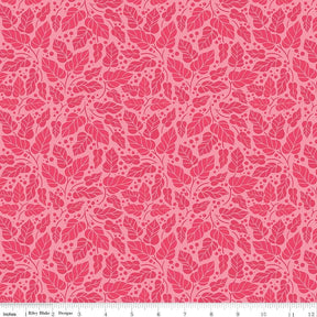 a repeating pattern of pink leaves and dots on a pink background.