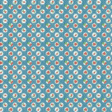 The image is a repeating pattern of small circles filled with various colors, including shades of blue, green, and red, creating a visually appealing and intricate design.