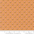 a repeating pattern of small pink flowers on an orange background, with a ruler for scale at the bottom.