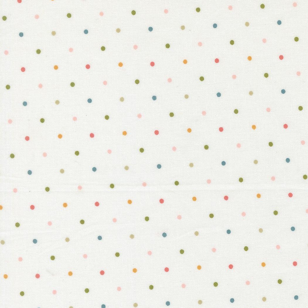 a white background with a pattern of multicolored polka dots.
