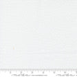 The image is a plain white fabric with small white dots, and it is being measured for size.