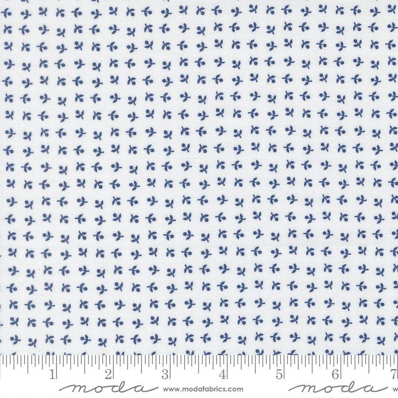 The image is a fabric with a repeating pattern of small blue flowers or leaves. The pattern is evenly spaced and covers the entire fabric. The fabric appears to be made of a material with a white background, and the image is described in terms of its size and the number of blue flowers or leaves it contains.