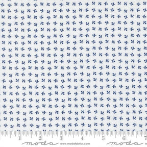 The image is a fabric with a repeating pattern of small blue flowers or leaves. The pattern is evenly spaced and covers the entire fabric. The fabric appears to be made of a material with a white background, and the image is described in terms of its size and the number of blue flowers or leaves it contains.