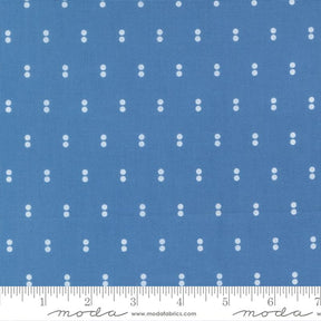 a blue fabric with white dots arranged in a grid pattern.