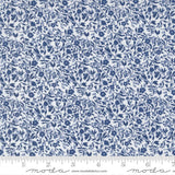 The image is a close-up of a fabric with a blue floral pattern.