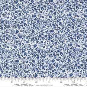 The image is a close-up of a fabric with a blue floral pattern.