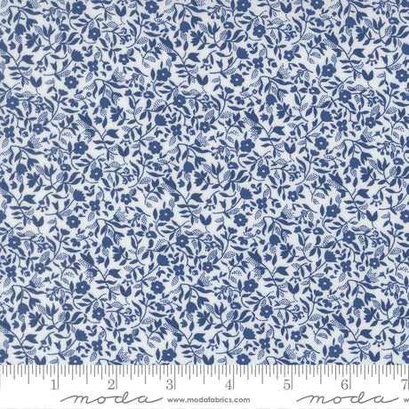 The image is a close-up of a fabric with a blue floral pattern.