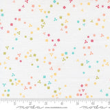 The image is a fabric with a pattern of small colorful flowers scattered across it.