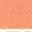 The image is a fabric with a repeating pattern of small white crosses or dots on an orange background.