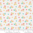 The image is a fabric with a floral pattern, featuring small colorful flowers and leaves scattered across it.