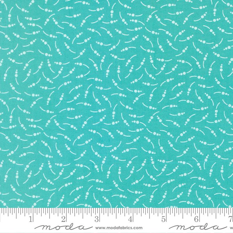 a fabric with a teal blue color and a repeating pattern of white dots or lines, creating a visually interesting and textured design.