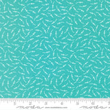 a fabric with a teal blue color and a repeating pattern of white dots or lines, creating a visually interesting and textured design.