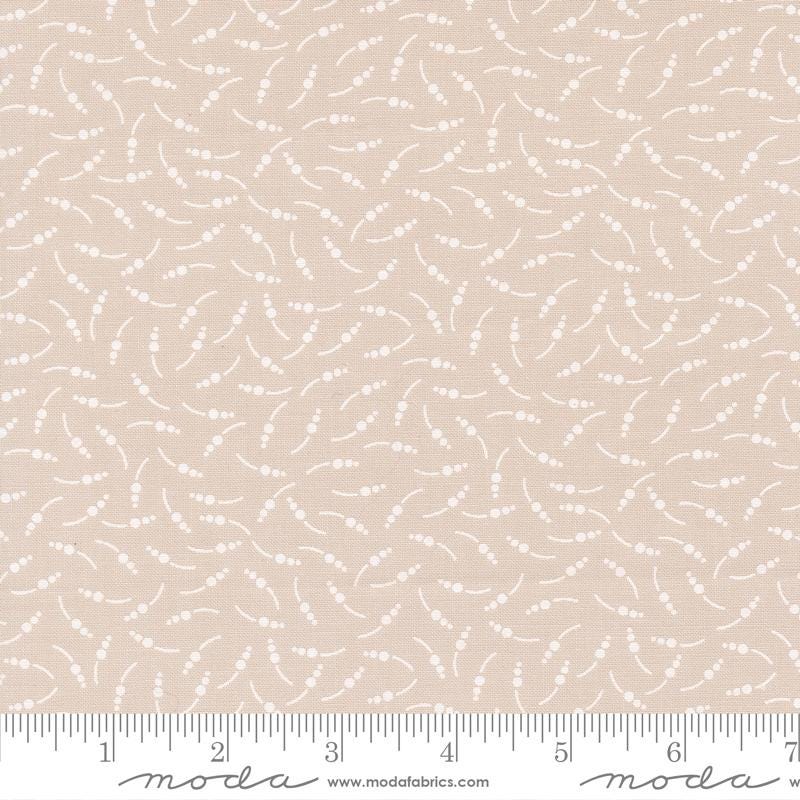 The image is a fabric with a repeating pattern of small white dots or circles, creating a textured and visually interesting design.