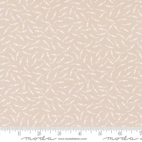 The image is a fabric with a repeating pattern of small white dots or circles, creating a textured and visually interesting design.