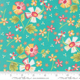 The image is a vibrant and colorful fabric with a repeating pattern of flowers in various shades of pink, yellow, and green against a teal background.