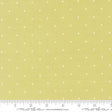 The image is a fabric with a yellow background and white dotted pattern. There is a ruler at the bottom of the image for scale.