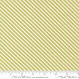 a repeating diagonal pattern of yellow and white stripes, with a ruler indicating the size of the fabric.