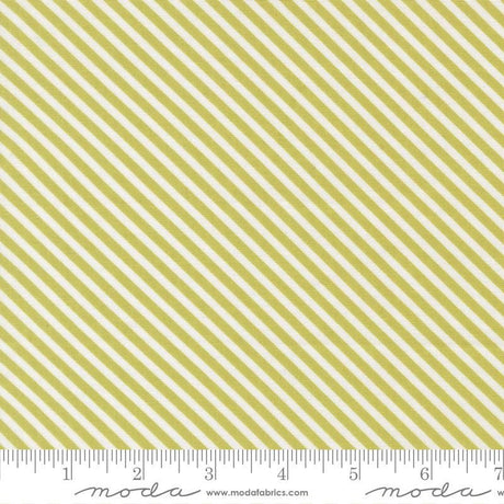 a repeating diagonal pattern of yellow and white stripes, with a ruler indicating the size of the fabric.