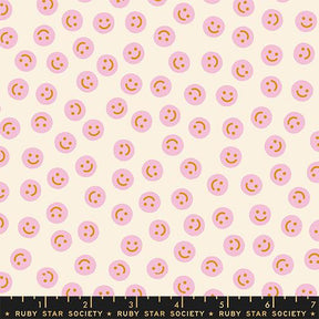 a repeating pattern of pink smiley faces on a light beige background.