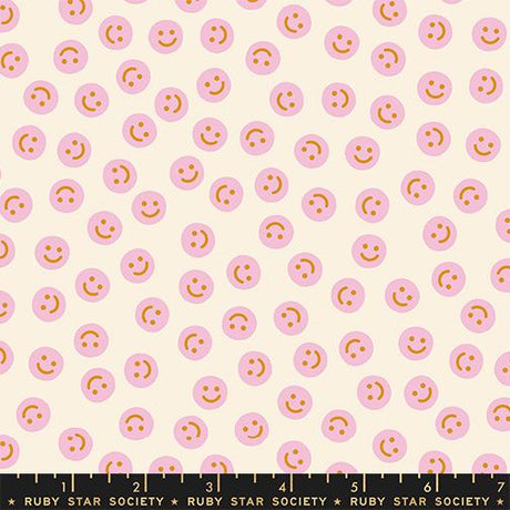 a repeating pattern of pink smiley faces on a light beige background.