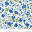 The image is a close-up of a fabric with a floral pattern in shades of blue and green. The pattern consists of various blue flowers and green leaves arranged in a repeating design. The fabric appears to be a white material with the floral pattern printed on it.