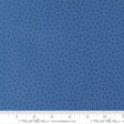 The image is a close-up of a fabric with a blue star pattern.