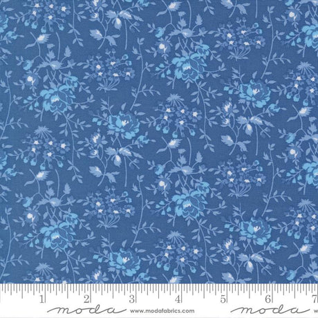 The image is a close-up of a fabric with a blue floral pattern.