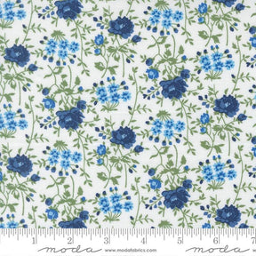 a repeating pattern of blue flowers and green leaves on a white background.
