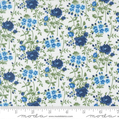 a repeating pattern of blue flowers and green leaves on a white background.