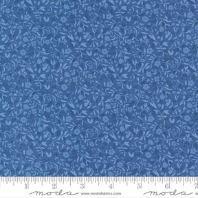 The image is a close-up of a fabric with a blue floral pattern.