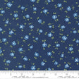 a fabric with a repeating pattern of blue flowers and green leaves on a dark blue background.
