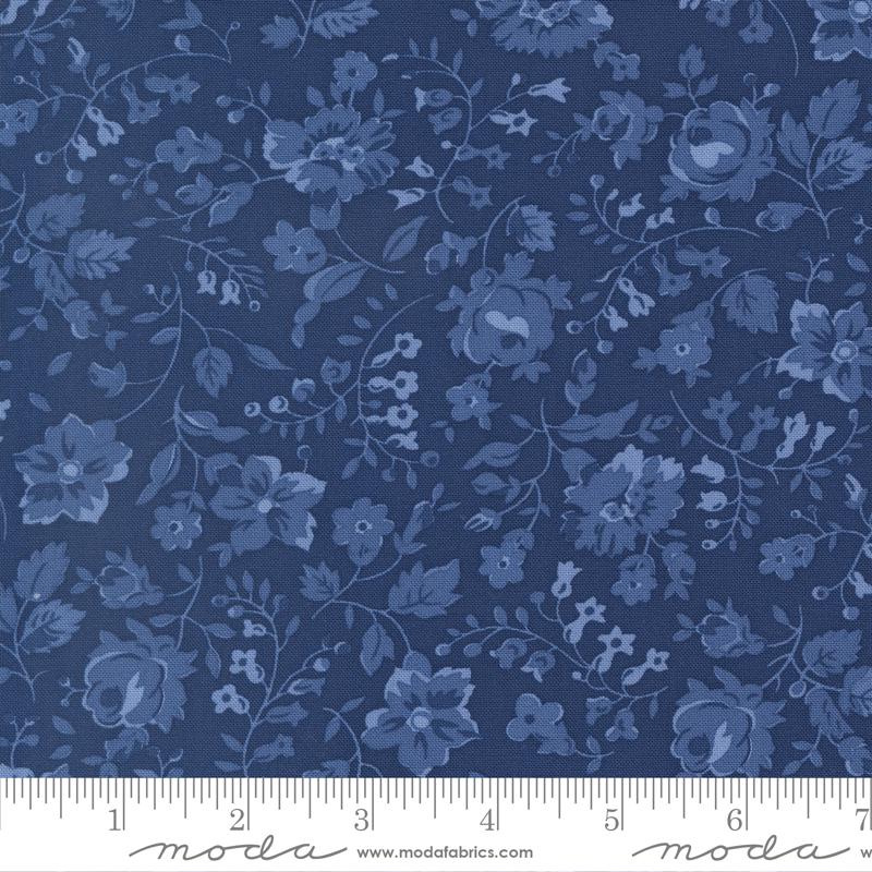 The image is a close-up of a fabric with a blue floral pattern.