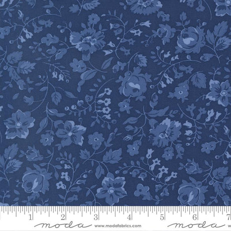 The image is a close-up of a fabric with a blue floral pattern.