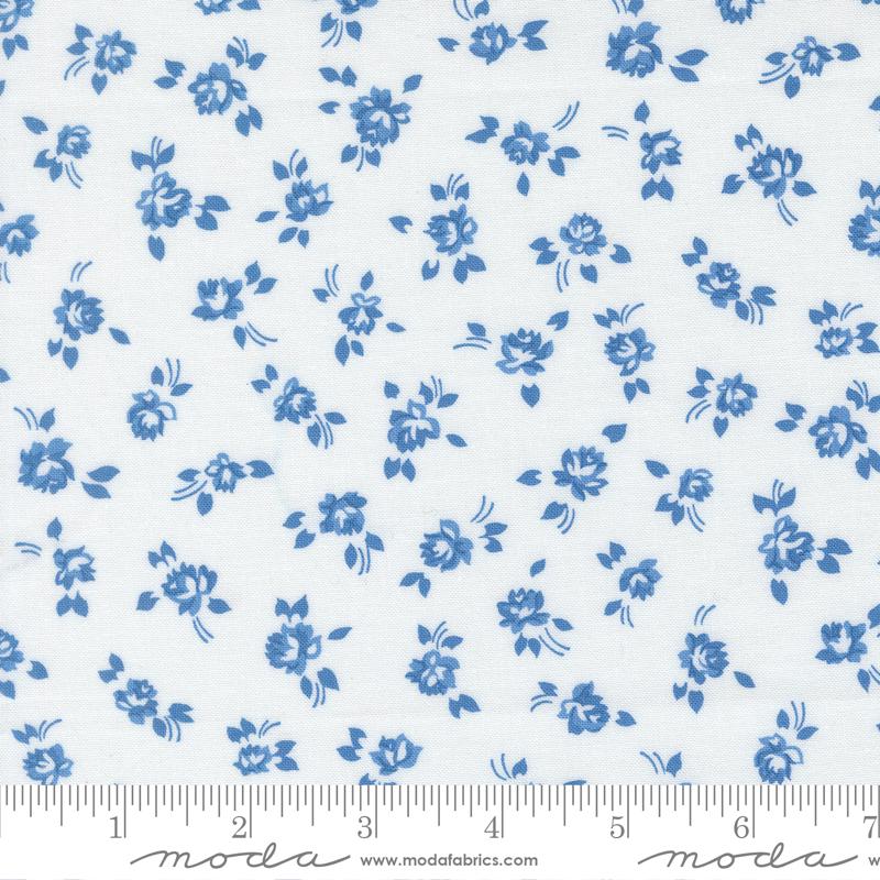 a repeating pattern of blue flowers on a white background.