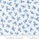 a repeating pattern of blue flowers on a white background.