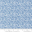 The image is a close-up of a fabric with a blue floral pattern.