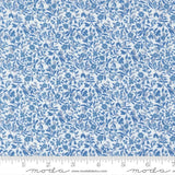 The image is a close-up of a fabric with a blue floral pattern.