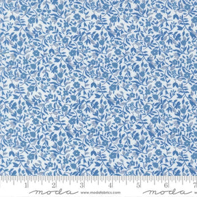 The image is a close-up of a fabric with a blue floral pattern.