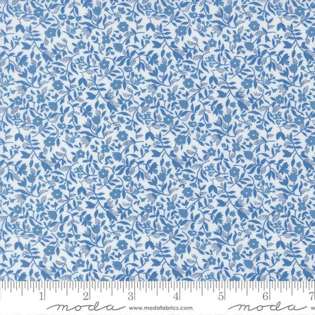 The image is a close-up of a fabric with a blue floral pattern.