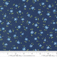 a fabric with a repeating pattern of blue flowers and green leaves on a dark blue background.