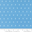 a blue fabric with white dots arranged in a grid pattern.