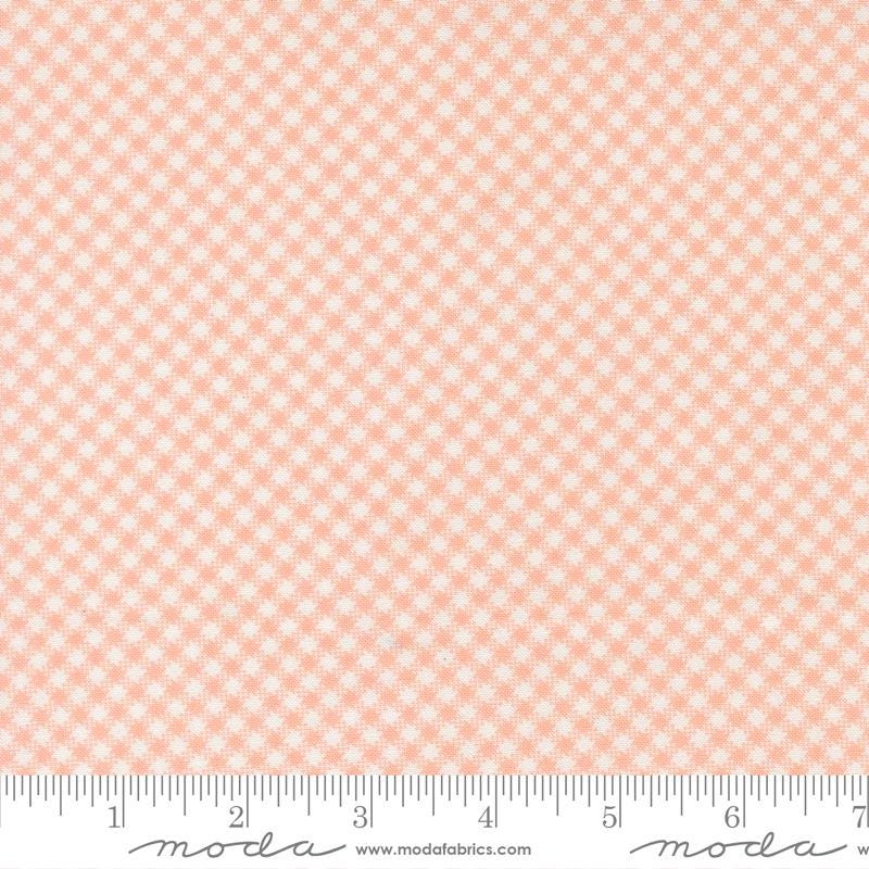 The image is a fabric with a pink and white checkered pattern.