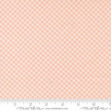 The image is a fabric with a pink and white checkered pattern.