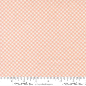 The image is a fabric with a pink and white checkered pattern.